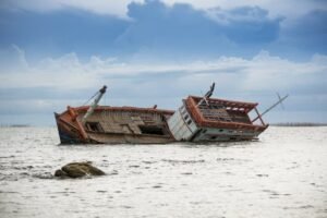 boat-capsized-sea-danger-rock-45892663